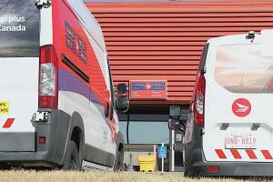 Canada Post vehicles pictured in Red Deer. The Canadian Union of Postal Workers and Canada Post have reached tentative agreements for the union&rsquo;s two bargaining units. (Red Deer Advocate file)