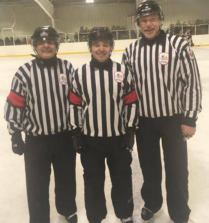 Hockey North officials, from left, branch referee-in-chief Darrell Greer; Level II official Kyle Tattuinee, of Rankin Inlet; and Level IV official Craig Hockridge, of Yellowknife, get ready to officiate a Jon Lindell Memorial senior men&rsquo;s tournament in Arviat in 2015. Greer and Tattuinee were friends with Hockridge at the time of his passing. Photo courtesy of Hockey North