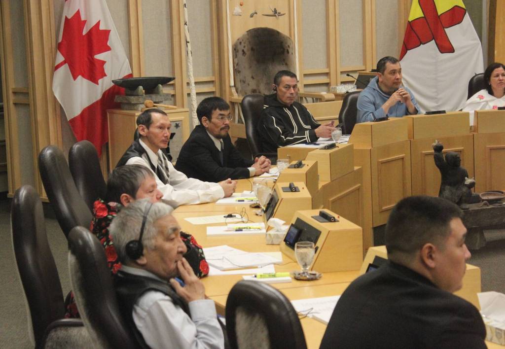 Alexander Sammurtok, MLA for Rankin Inlet North-Chesterfield Inlet, wearing headphones in the foreground, continues to ask when Elders vans will be operational. Five such vans were delivered to Rankin Inlet, Coral Harbour, Iqaluit, Cambridge Bay and Pangnirtung during the summer of 2024, but the vehicles have sat idle ever since. NNSL file photo