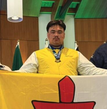 Gabe Oyukuluk earned gold in the Dene games finger pull on Day 5 of the Arctic Winter Games in Whitehorse. Photo courtesy Nunavut Federation of Sport